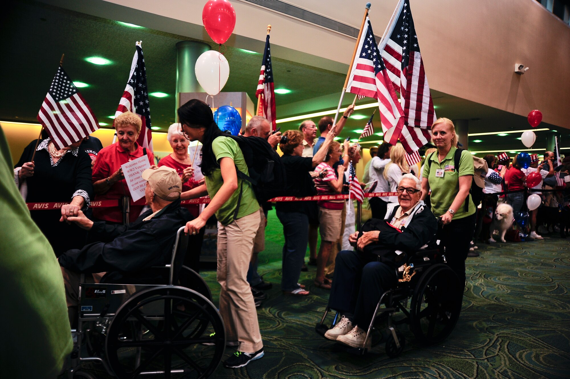 Seventy seven World War II veterans on the seventh Honor Flight of Central West Florida are welcomed home at the St. Petersburg Clearwater International Airport, Fla. Sept. 18, 2012. More than 300 people including Airmen from MacDill Air Force Base welcomed the veterans’ home. (U.S. Air Force photo by Staff Sgt. Angela Ruiz)