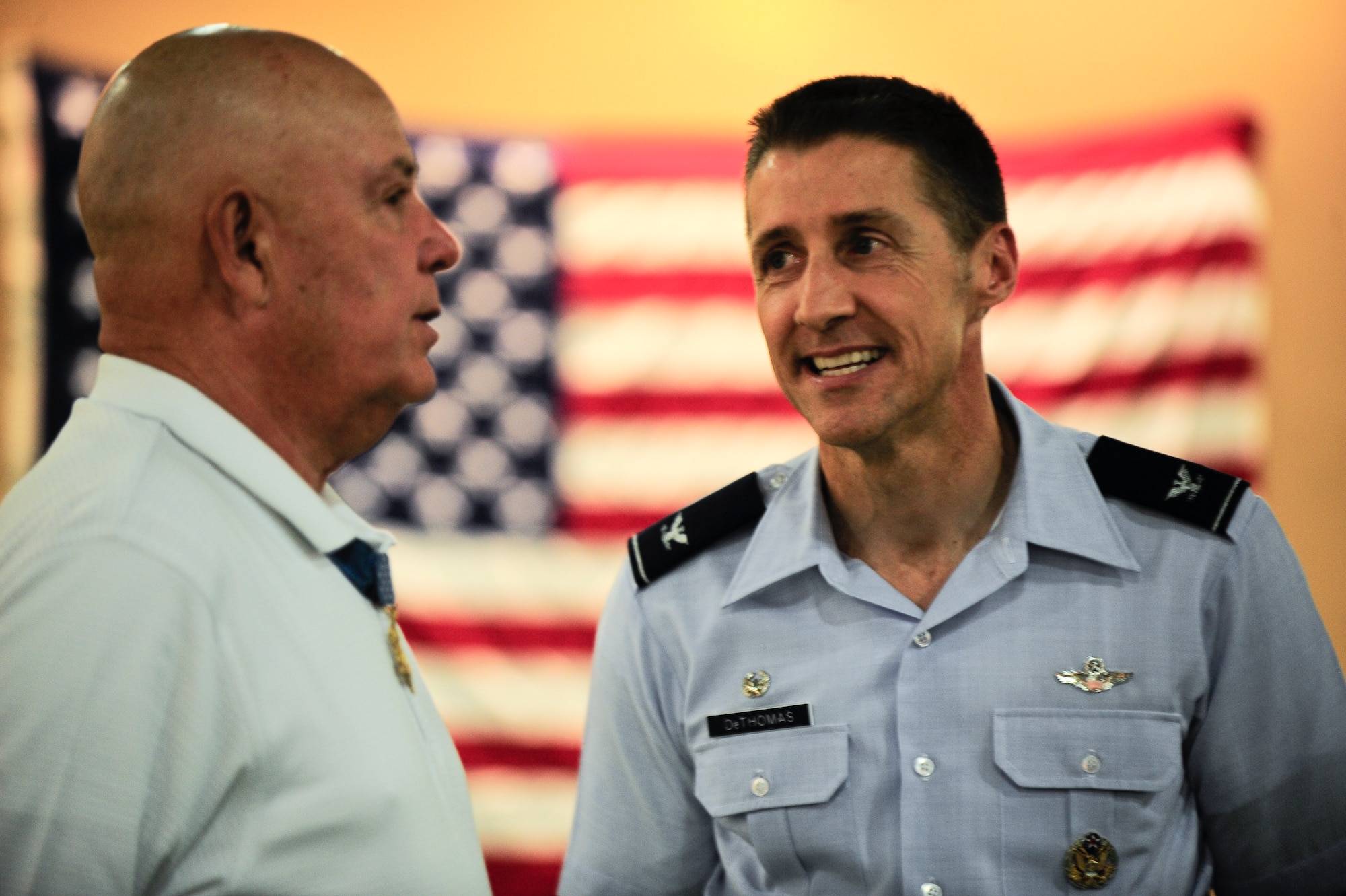 Medal of Honor recipient retired Army Command Sgt. Maj. Gary Littrell talks with Col. Scott DeThomas, 6th Air Mobility Wing commander, while awaiting the arrival of the seventh Honor Flight of West Central Florida at the St. Petersburg Clearwater International Airport, Fla Sept. 18, 2012. The Honor Flight Network is a non-profit organization that transports our heroes to Washington, D.C. to visit the WWII memorial. (U.S. Air Force photo by Staff Sgt. Angela Ruiz)
