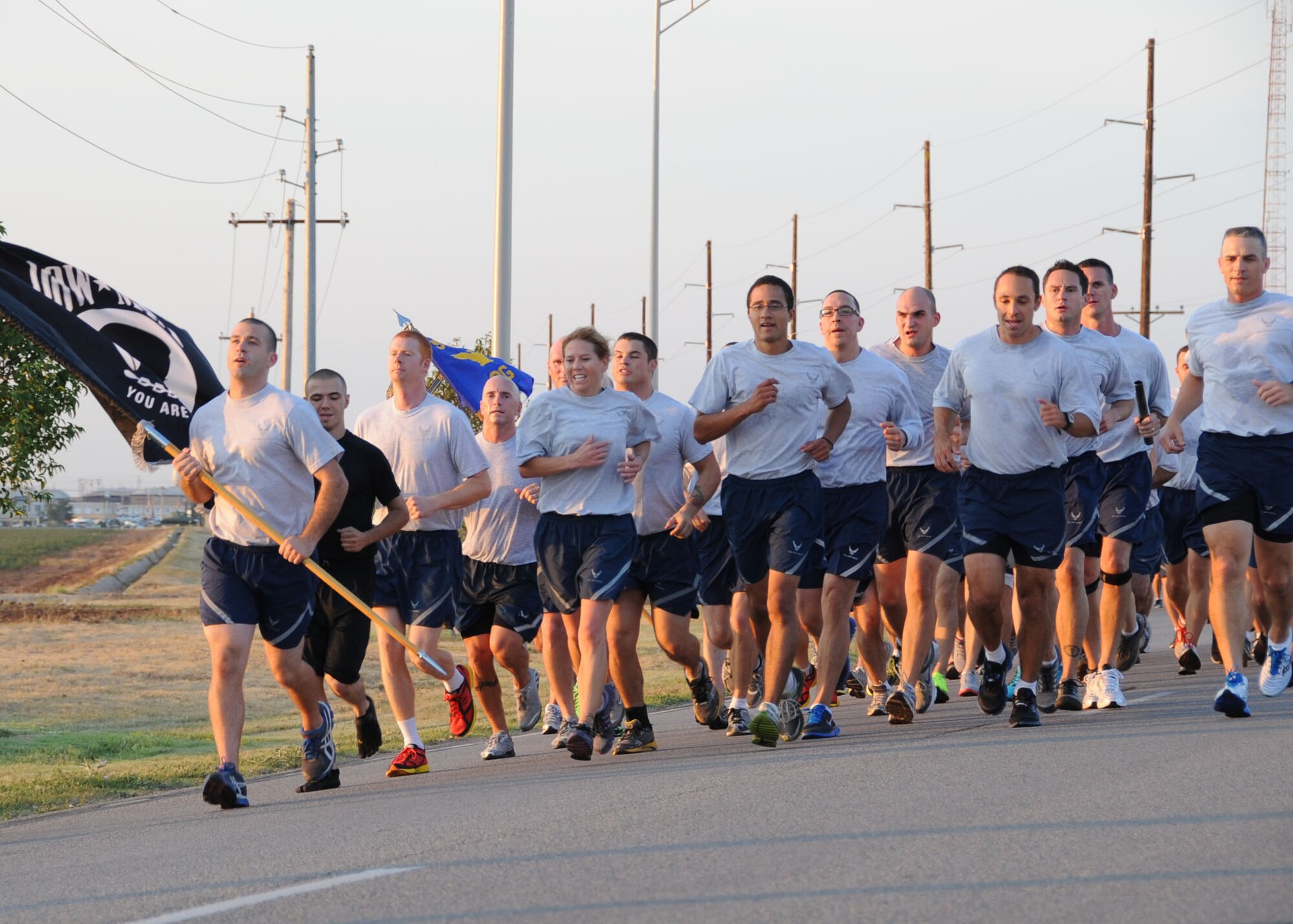 ALTUS AIR FORCE BASE, Okla. – Members of the 97th Air Mobility Wing run back to base during the remembrance run, Sept. 21, 2012.  The run took place after the Prisoner of War/Missing in Action remembrance ceremony held at the Jackson County Courthouse.  (U.S. Air Force photo by Master Sgt. Rebecca F. Corey/Released)