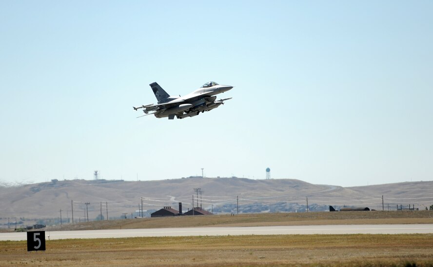 An F-16 assigned to the South Dakota Air National Guard’s 175th Fighter Squadron darts off the runway at Ellsworth Air Force Base, S.D., Sept. 18, 2012. The 114th Fighter Wing’s Fighting Lobos conducted missions from Ellsworth during the units 2012 Live Drop exercise, designed to help aircrews validate F-16 tactics, techniques and procedures during long-range strike missions. (U.S. Air Force photo by Airman 1st Class Hrair H. Palyan/Released)