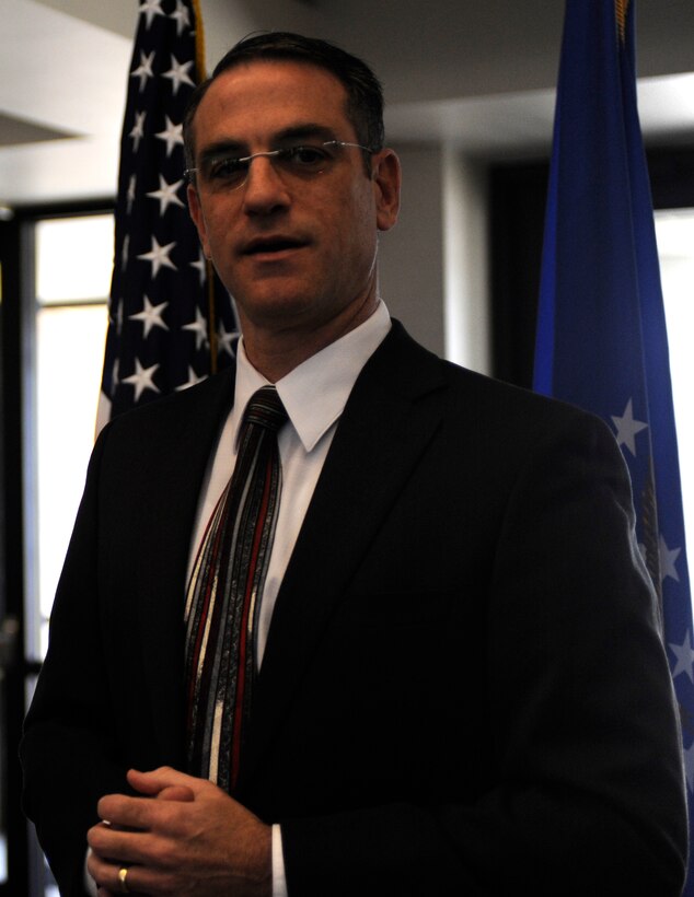 Gary Gualano, Air Force Financial Services Center director, addresses AFFSC staff as the last military members depart the AFFSC at Ellsworth Air Force Base, S.D., Sept. 19, 2012. Gualano spoke about the hard work and dedication of the Airmen, and expressed the center's appreciation of their time there. Civilian workers at the AFFSC will continue to handle travel pay functions, with military pay being transferred to base level financial management offices. (U.S. Air Force photo by Airman Ashley J. Woolridge/Released)