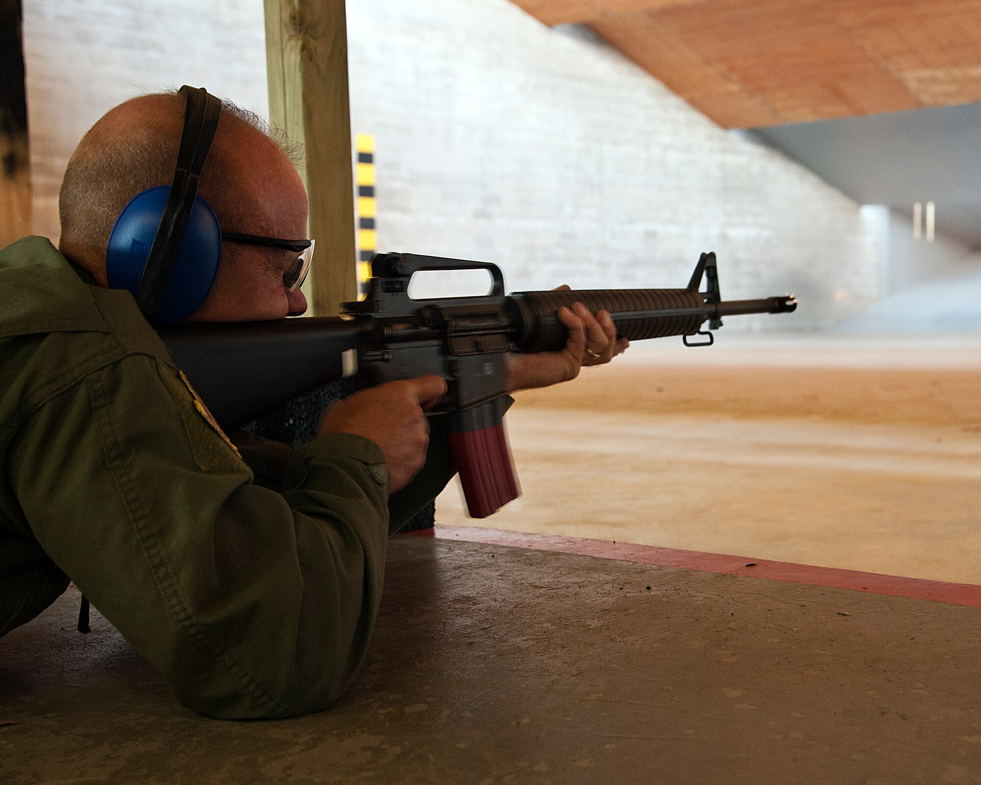 ALTUS AIR FORCE BASE, Okla. – Col. Anthony B. Krawietz, 97th Air Mobility Wing commander, fires an M-16A2 service rifle at the Combat Arms firing range Sept. 20, 2012. Krawietz was a participant in the 2012 Elementary Level Excellence in Competition. The EIC allows any member of the Armed Forces to participate and compete individually for points toward an EIC Badge, which may be worn on service dress uniforms. (U.S. Air Force photo by Senior Airman Kenneth W. Norman / Released)