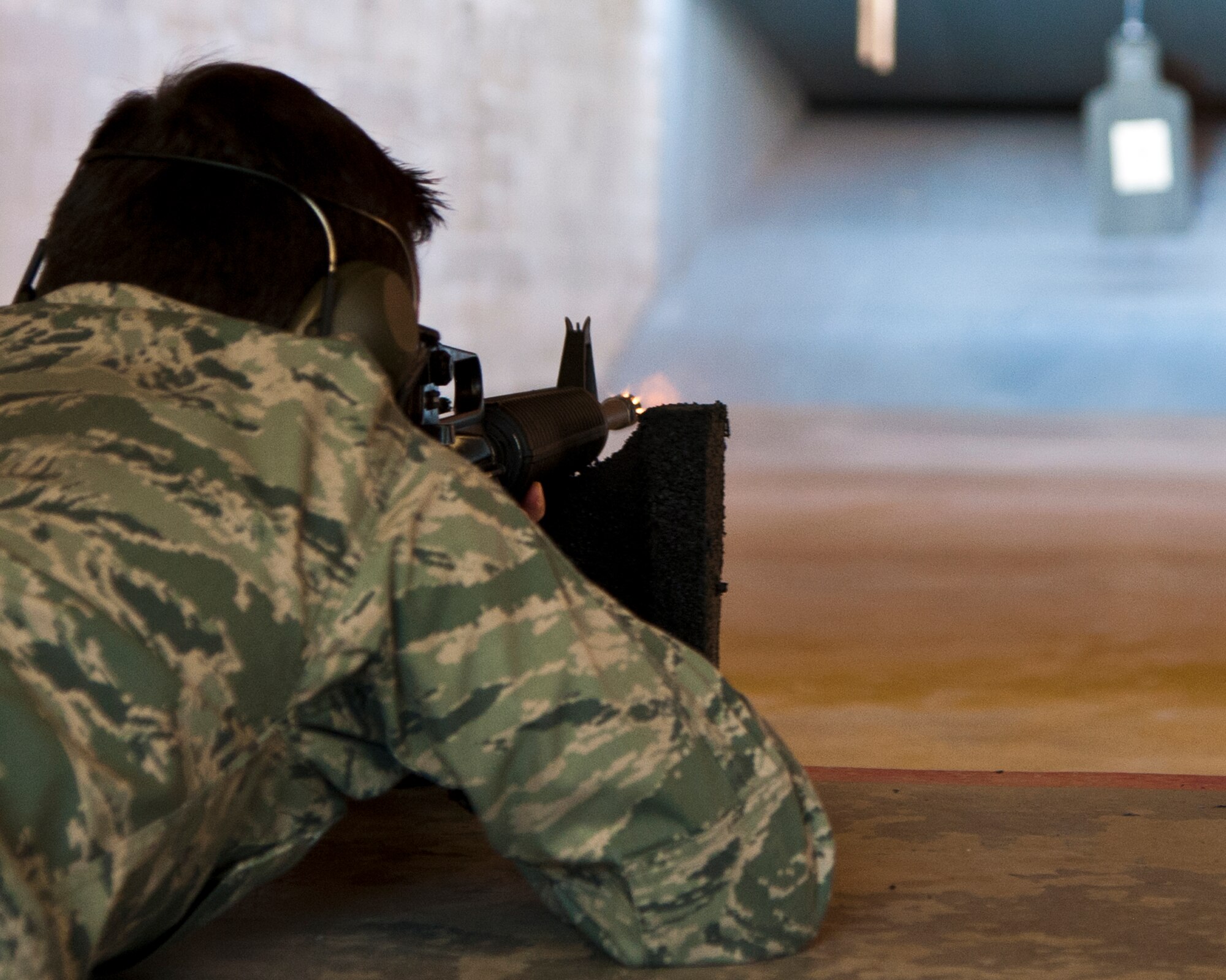 ALTUS AIR FORCE BASE, Okla. -- Maj. Rebb Jones, 97th Air Mobility Wing chief executive, fires an M-16A2 service rifle at the Combat Arms firing range Sept. 20, 2012. Jones was a participant in the 2012 Elementary Level Excellence in Competition. The EIC allows any member of the Armed Forces to participate and compete individually for points toward an EIC badge, which may be worn on service dress uniforms. (U.S. Air Force photo by Senior Airman Kenneth W. Norman / Released)