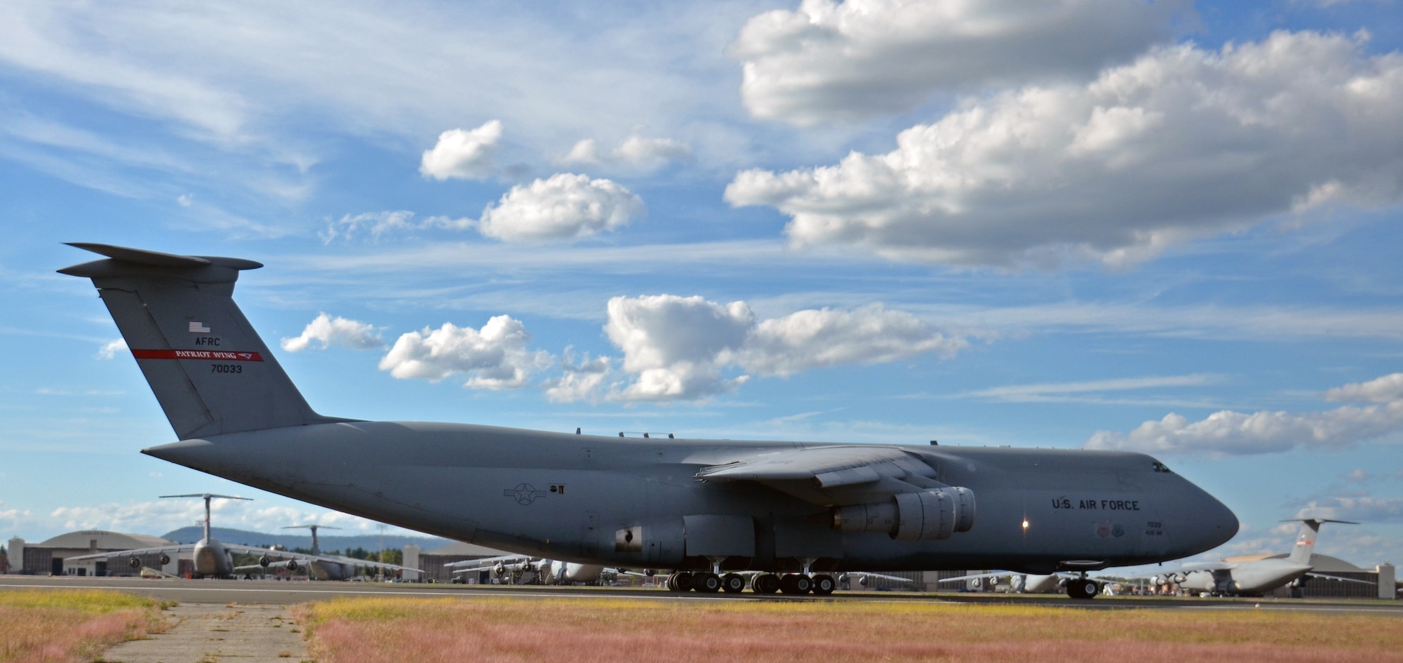 A Westover C-5 briefly touches down on runway 05 before taking off again during a local training mission, Sept. 20, 2012. The 439th Airlift Wing is the Air Force Reserve's only stand-alone host C-5 unit in the nation. At 2,500 acres, Westover is the largest AF Reserve base in the country. (U.S. Air Force photo by SrA. Kelly Galloway)