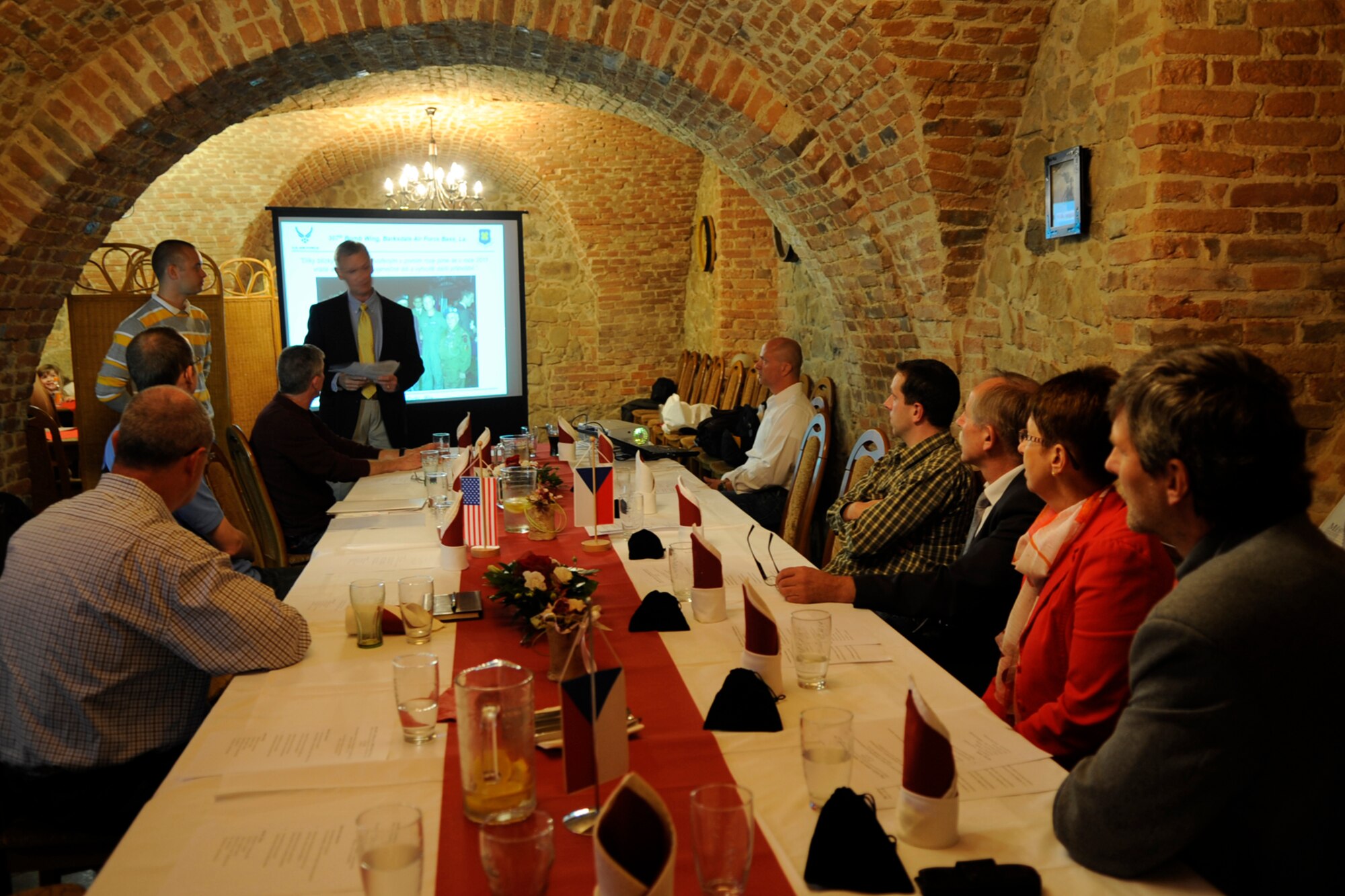 Col. Joseph Jones, the 307th Bomb Wing vice commander briefs four Ostrava village mayors at the Castle Restaurant about the 307 BW during a dinner Sept. 19, 2012. The wing is participating in the NATO Days Air Show in Ostrava, Czech Republic, where they are displaying a B-52 Stratofortress Sept. 22-23. (U.S. Air Force photo by Senior Master Sgt. Jessica Daurizio/Released)