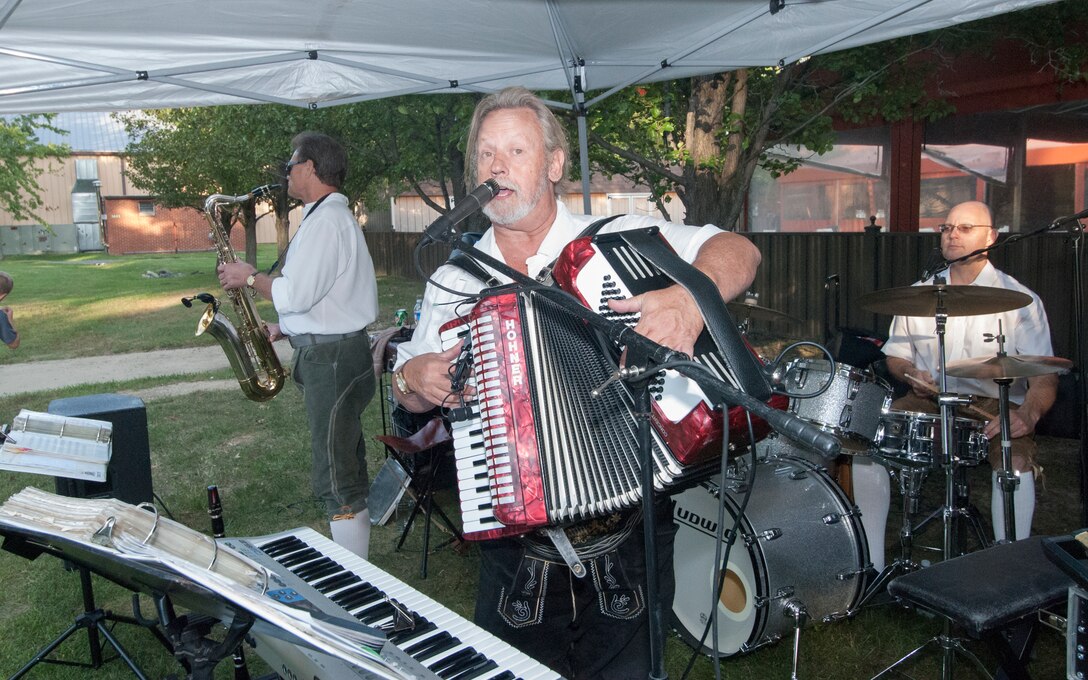 Mike Surratt and the Continentals of Washington, D.C., play a polka song during the Oktoberfest event at the Joint Base Andrews Community Activity Center on Sept. 14, 2012. The event, sponsored by 11th Forces Support Squadron, brought German culture to Joint Base Andrews with an evening of Bavarian food, music and contests.(Courtesy photo/ Bobby Jones)