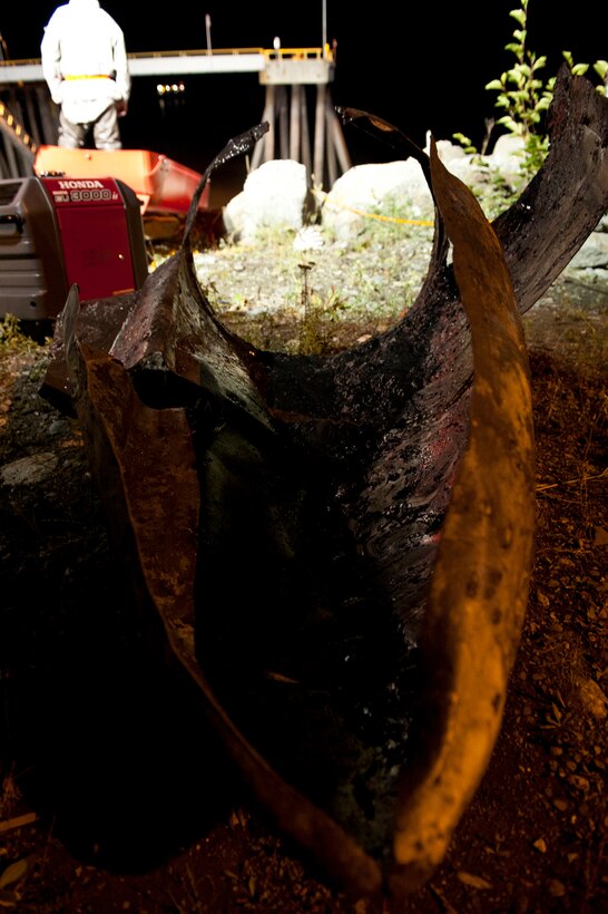 The head piece to an F-4 Phantom II fuel tank recovered by the Joint Base Elmendorf-Richardson Crash Recovery Unit and the Anchorage Port Authority from the Port of Anchorage, Alaska, Sept. 18, 2012. The Anchorage Port Authority and the Joint Base Elmendorf Richardson Crash Recovery Unit, under the 3rd Maintenance Squadron, are removing an F-4 fuel tank that is embedded in the harbor bank. (U.S. Air Force photo/Airman 1st Class Omari Bernard)