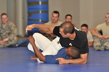 MINOT AIR FORCE BASE, N.D. - Ryron Gracie, fourth degree Black Belt and grandson of the creator of Gracie Jiu-Jitsu, Grand Master Helio Gracie, teaches members of the 5th Security Forces Squadron, a series of defensive techniques during his seminar at the security forces training building, Sept. 14. Gracie Jiu-Jitsu focuses primarily on defensive tactics, unlike other arts which focus more on offensive techniques. (U.S. Air Force photo/Senior Airman Brittany Y. Auld)
