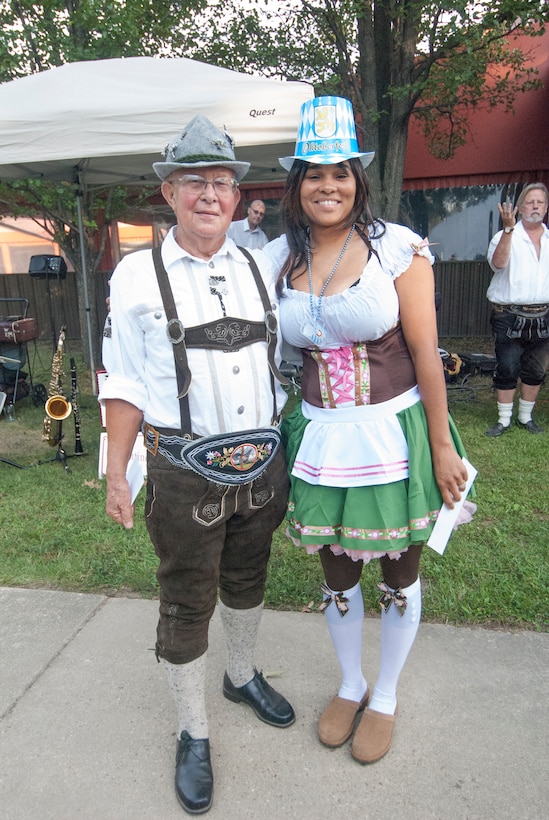 Retired Chief Master Sgt. Herb Proksch and Tech. Sgt. Dennise Griggs, 11th Civil Engineer Squadron Airman dormitory leader, pose for a photo after winning $100 each for the best male and female costume during an Oktoberfest event held at the Joint Base Andrews Community Activity Center on Sept. 14, 2012.The event, sponsored by 11th Forces Support Squadron, brought German culture to JBA with an evening of Bavarian food, music and contests. (Courtesy photo/ Bobby Jones)
