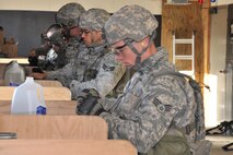 MINOT AIR FORCE BASE, N.D. -- Airmen from the 91st Security Forces Group’s Global Strike Challenge team, load ammunition into their magazines during combat arms training and maintenance here, Sept. 18. Minot Airmen from both the 5th Bomb Wing and the 91st Missile Wing are participating in this year's Global Strike Challenge from June through November, to showcase the world's premier bomber and ICBM forces and recognize outstanding AFGSC personnel and teams. (U.S. Air Force photo/Senior Airman Brittany Y. Auld)