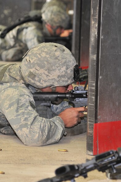 MINOT AIR FORCE BASE, N.D. -- Airmen from the 91st Security Forces Group’s Global Strike Challenge team, fire their weapons during combat arms training and maintenance at Minot Air Force Base, N.D., Sept. 18, 2012. Minot Airmen from both the 5th Bomb Wing and the 91st Missile Wing are participating in this year's Global Strike Challenge from June through November, to showcase the world's premier bomber and ICBM forces and recognize outstanding AFGSC personnel and teams. (U.S. Air Force photo/Senior Airman Brittany Y. Auld)