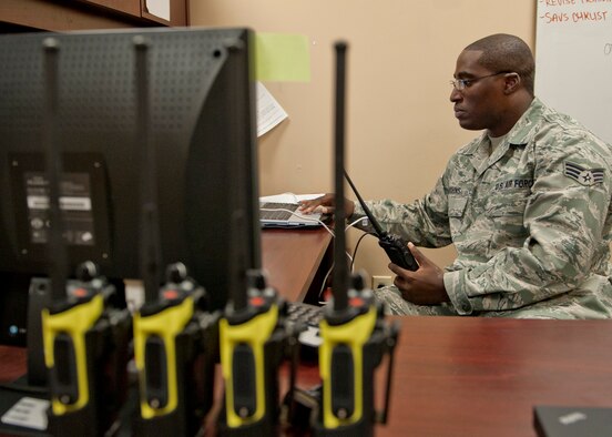 U.S. Air Force Senior Airman Pierre Hutchins, 23d Communications Squadron, programs an XTS-5000 Land Mobile Radio for base personnel use Aug. 30, 2012, at Moody Air Force Base, Ga. Newer radios such as the APX-7,000 LMR (yellow handle) are typically distributed to members of the 23d Security Forces Squadron. (U.S. Air Force photo by Senior Airman Eileen Meier/Released)