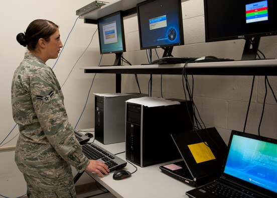 U.S. Air Force Airman 1st Class Andrea Luikart, 23d Communications Squadron, downloads new software to a customer’s personal computer Aug. 30, 2012, at Moody Air Force Base, Ga. Updates such as these ensures all computers are in top shape to support the Moody mission. (U.S. Air Force photo by Senior Airman Eileen Meier/Released)