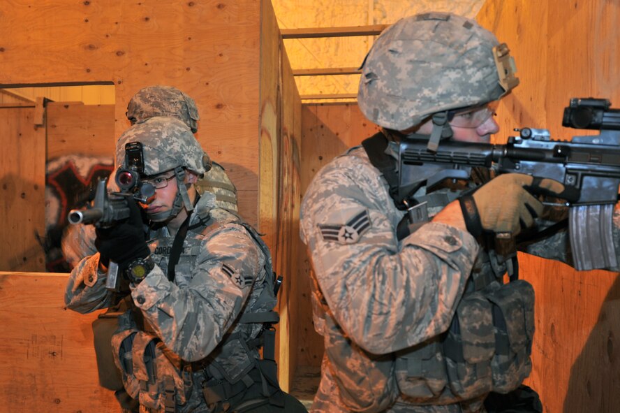 MINOT AIR FORCE BASE, N.D. -- Airmen from the 91st Security Forces Group’s Global Strike Challenge team, engage in exercise clearing scenarios here, Sept. 6. Minot Airmen from both the 5th Bomb Wing and the 91st Missile Wing are participating in this year's Air Force Global Strike Command Global Strike Challenge from June through November to showcase the world's premier bomber and ICBM forces and to recognize outstanding AFGSC personnel and teams. (U.S. Air Force photo/Senior Airman Brittany Y. Auld)