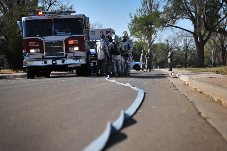 Emergency responders arrive near the scene of a staged accident during a major incident response exercise at Cannon Air Force Base, N.M., Sept. 20, 2012. Emergency responders from across the installation as well as several external agencies were included in the exercise to better train and prepare base personnel for real world situations. (U.S. Air Force photo/Airman 1st Class Alexxis Pons Abascal) 