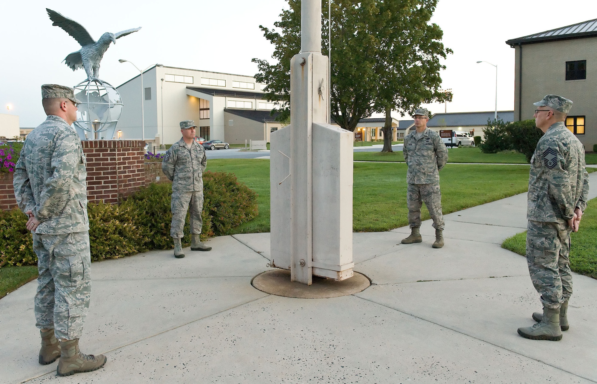Senior leadership from the 512th and 436th Airlift Wings participate in an around-the-clock vigil Sept. 21, 2012, at the base flag pole in honor of POW/MIA Recognition Day. It's one of six days specified by law on which the black POW/MIA flag shall be flown over federal facilities and cemeteries, post offices and military installations. Pictured from left to right are Col. Richard G. Moore Jr., 436th AW commander, Chief Master Sgt. James B. Lucas, 436th AW command chief, Col. Raymond A. Kozak, 512th AW commander, and Chief Master Sgt. Matthew Sirkis, 512th Maintenance Group chief enlisted adviser. (U.S. Air Force photo/Roland Balik)