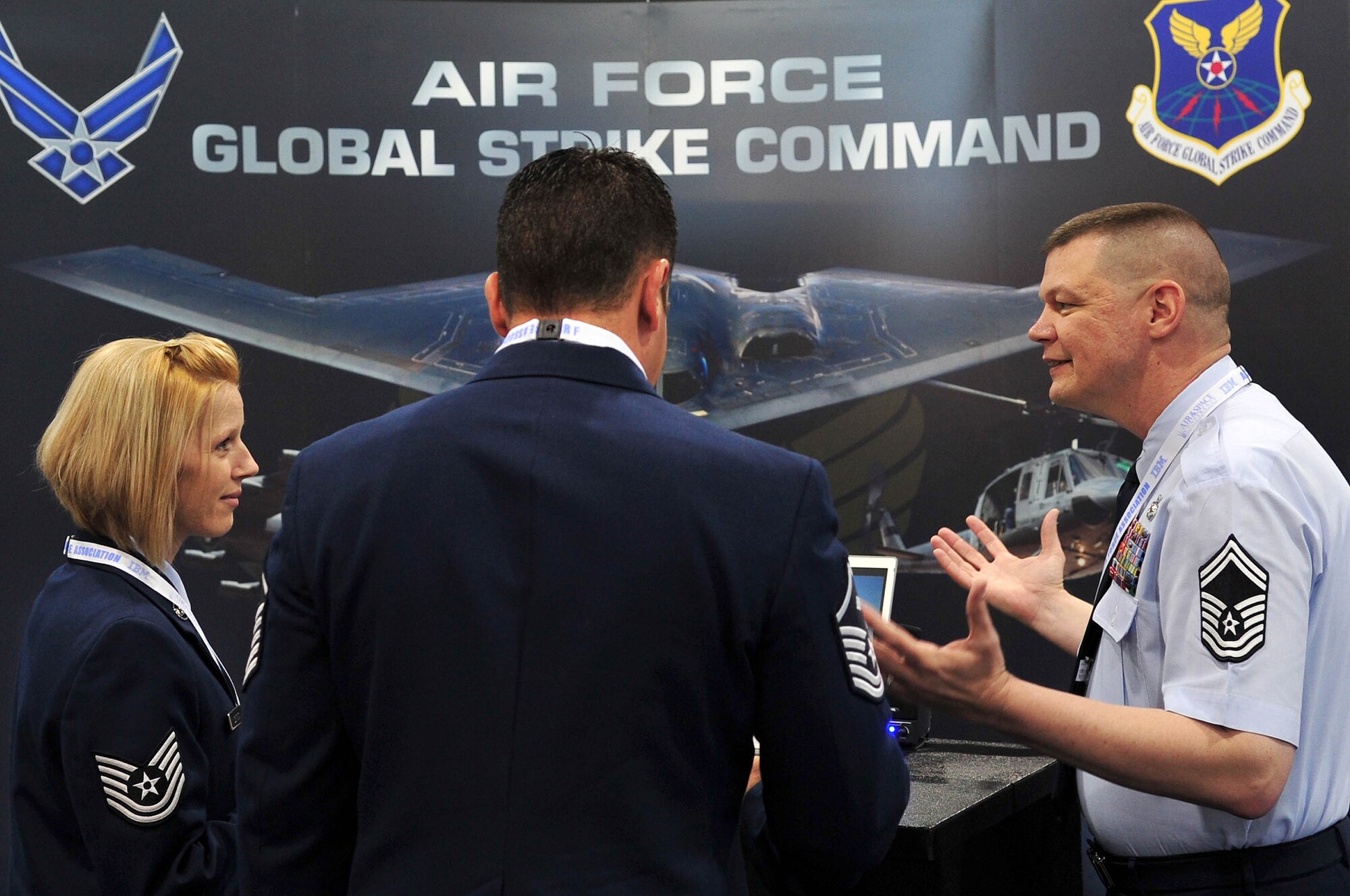 Tech. Sgt. Stacy Settles and Master Sgt Michael Schoenly, both Joint Base Andrews, Md. get answers about the B-52 from Senior Master Sgt. Michael Curry, Air Force Global Strike Command, Barksdale Air Force Base, La. during this year?s Air Force Association Air and Space Conference and Technology Exposition, Washington D.C., Sept. 17-19, 2012. Air Force Global Strike Command is commemorating the 60th anniversary of the first flight of the B-52 Stratofortress on April 15, 1952, with yearlong events centered around the theme: "The B-52: An Icon of American Airpower." AFGSC is responsible for the nation's three intercontinental ballistic missile wings, the two B-52 wings and the only B-2 wing. (U.S. Air Force photo by Senior Airman Steele C. G. Britton)