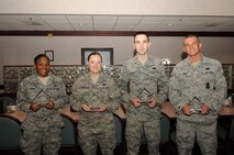 September’s Diamond Sharp Award recipients at Grand Forks Air Force Base, N.D., are (from left ): Airman 1st Class Adena Coney, 319th Wing Staff Agencies; Senior Airman Alexandra Crawley, 319th Force Support Squadron; Airman 1st Class Charles Cooper, 69th Maintenance Squadron; and Airman 1st Class Tyler Burt, 319th Security Forces Squadron. (U.S. Air Force photo by Staff Sgt. Amanda N. Grabiec)