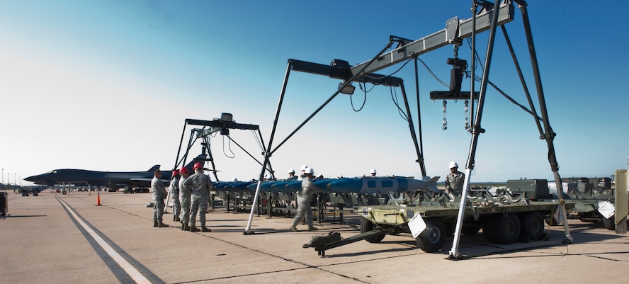 Airmen from the 7th Maintenance Group prepare to assemble munitions during the 3rd annual Global Strike Challenge Sept. 19, 2012, at Dyess Air Force Base, Texas. During the first event, the team had a maximum of 90 minutes to assemble 18 Joint Direct Attack Munitions on a munitions assembly conveyor. (U.S. Air Force photo by Airman 1st Class Jonathan Stefanko/ Released)