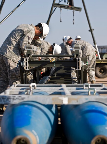 Airmen from the 7th Maintenance Group prepare to assemble munitions during the 3rd annual Global Strike Challenge Sept. 19, 2012, at Dyess Air Force Base, Texas. During the first event, the team had a maximum of 90 minutes to assemble 18 Joint Direct Attack Munitions on a munitions assembly conveyor. (U.S. Air Force photo by Airman 1st Class Jonathan Stefanko/ Released)