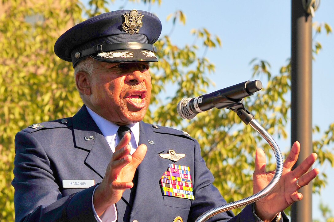 Former prisoner of war U.S. Air Force Col. (Ret.) Norman A. McDaniel speaks about his experiences and remembers those who are "never forgotten" during a POW Remembrance Ceremony, Sept. 21, at the Airmen Memorial Building in Suitland, Md. McDaniel was shot down and captured on July 20, 1966, while flying over North Vietnam. He remained a prisoner of war until released on February 12, 1973. (U.S. Air Force photo by Senior Airman Steele C. G. Britton)