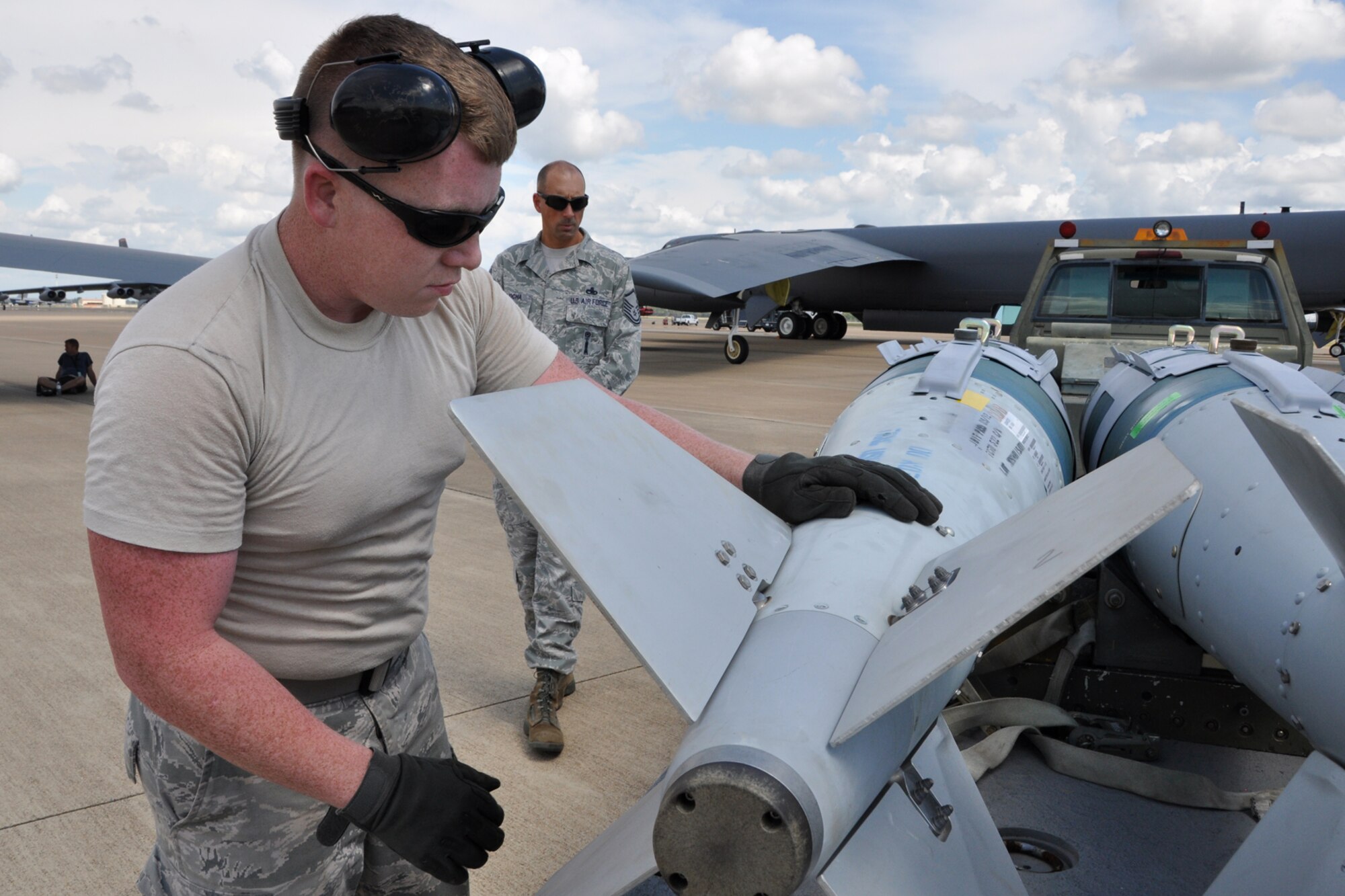 Staff Sgt. Robert Sowell, a weapons loader assigned to the 307th Maintenance Squadron, checks a load of GB U-31 bombs for discrepancies and serviceability at Barksdale Air Force Base, La., Sept. 13, 2012. Sowell was participating in the weapons loading portion of the 2012 annual Global Strike Challenge at Barksdale. (U.S. Air Force photo by Master Sgt. Jeff Walston)   
