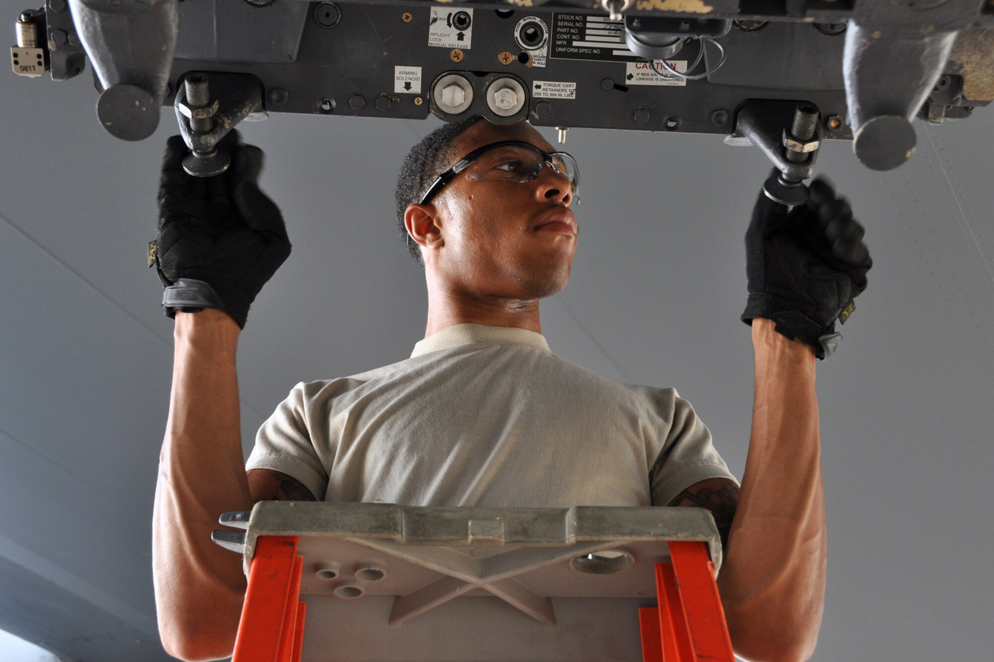 Senior Airman Tyshaun Owens, a weapons loader assigned to the 307th Maintenance Squadron, presets a bomb rack before a weapons load at Barksdale Air Force Base, La., Sept. 13, 2012. Owens was participating in the weapons loading portion of the 2012 annual Global Strike Challenge at Barksdale. (U.S. Air Force photo by Master Sgt. Jeff Walston)   