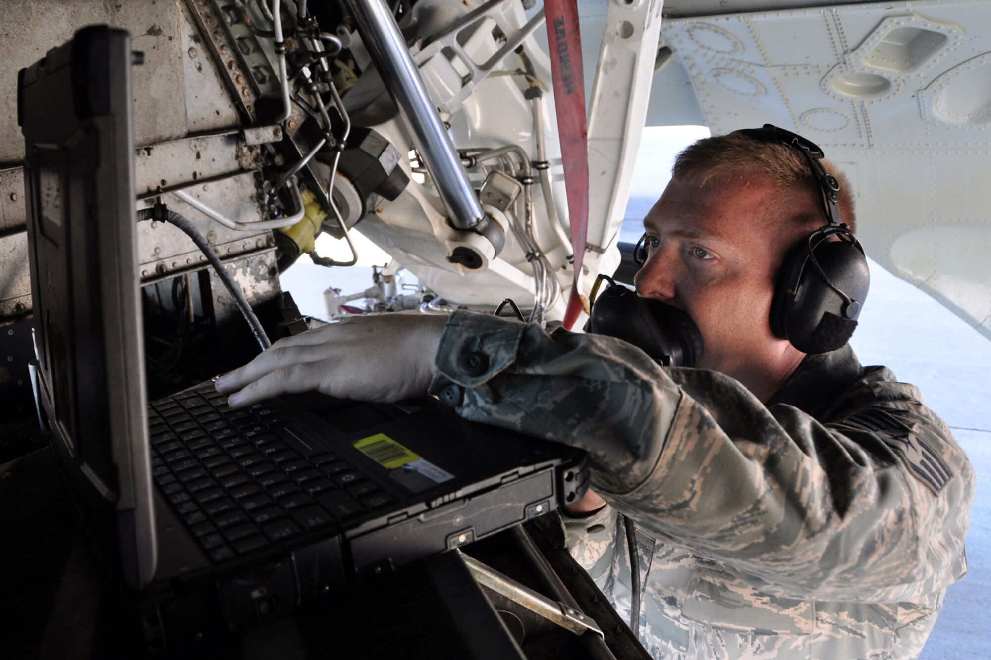 Staff Sgt. Mark Lindsay, a B-52 Stratofortress crew chief assigned to the 307th Aircraft Maintenance Squadron, checks operation instructions as the flaps are lowered on a jet at Barksdale Air Force Base, La., Sept. 13, 2012. Lindsay was participating in the crew chief Aircraft Preflight Inspection competition as part of the 2012 annual Global Strike Challenge at Barksdale. (U.S. Air Force photo by Master Sgt. Jeff Walston)   