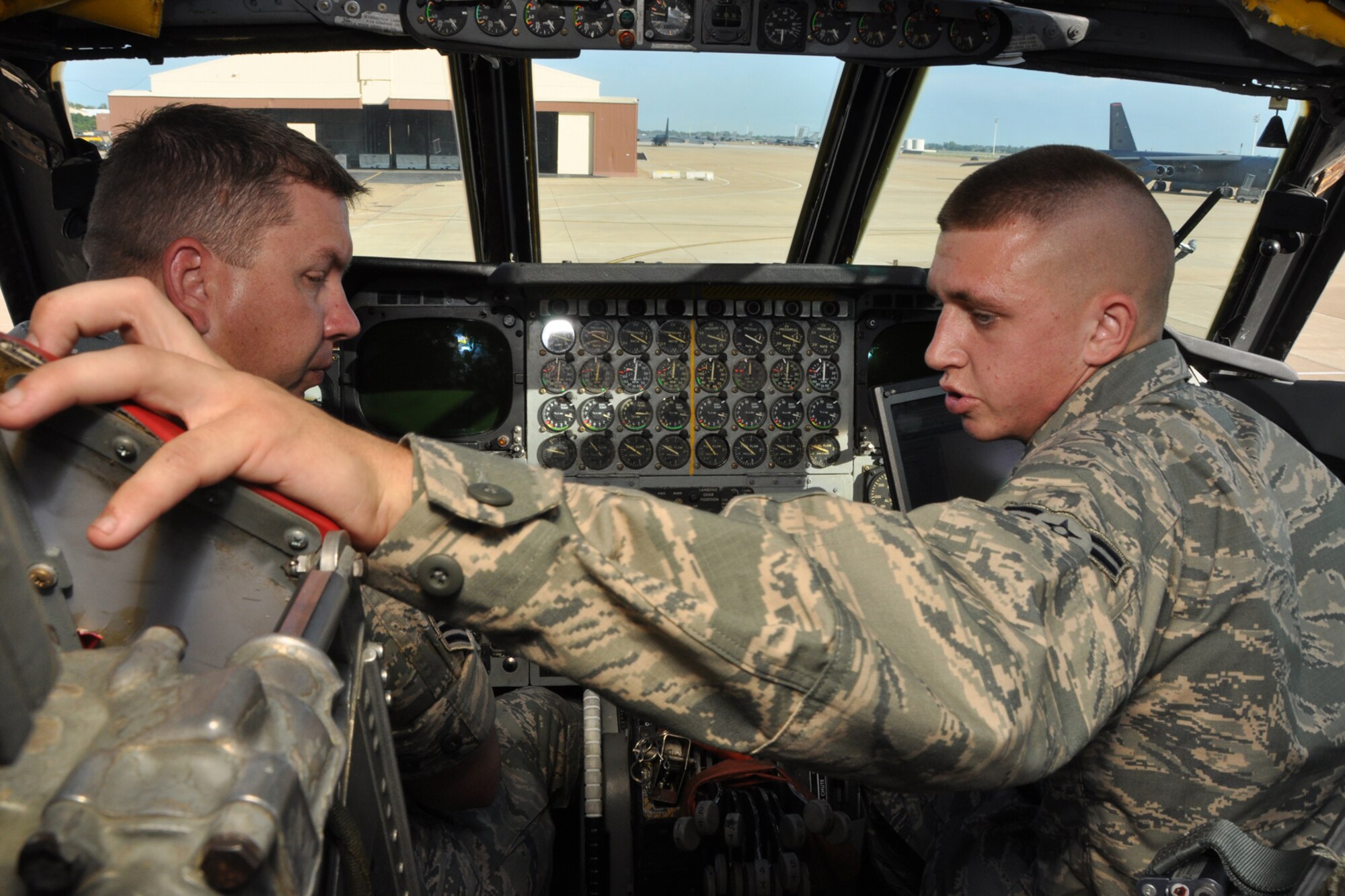 Airman 1st Class Jeff Wilson, a B-52 Stratofortress crew chief assigned to the 307th Aircraft Maintenance Squadron, explains the process of making an ejection seat safe for maintenance to Master Sgt. Wesley Clark, 8th Air Force, evaluator, in the cockpit of a B-52 Stratofortress on Barksdale Air Force Base, La., Sept. 13, 2012. Wilson was participating in the crew chief Aircraft Preflight Inspection competition as part of the 2012 annual Global Strike Challenge at Barksdale. (U.S. Air Force photo by Master Sgt. Jeff Walston)   