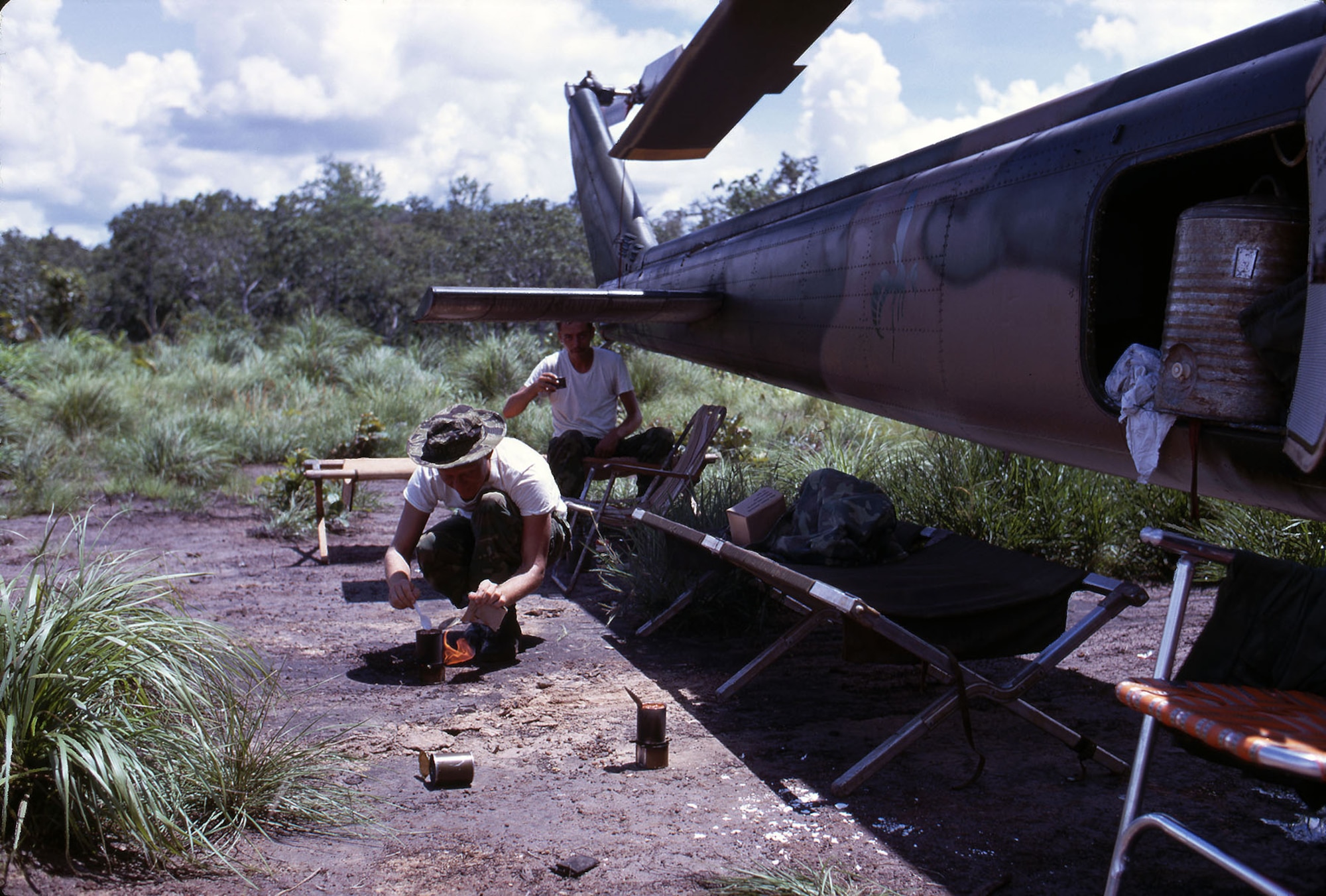 The crew of a 20th Special Operations Squadron UH-1 crew on alert at Thieu Atar, a forward operating location near the border of Laos. When a call came, they quickly put their cots, folding chairs and other items back into the baggage compartment. (U.S. Air Force photo)