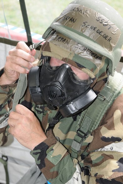 Staff Sgt. Bryan Schroeder dons MOPP 4 gear during a simulated aerial attack at the 132nd Fighter Wing (132FW), Des Moines, Iowa on September 20, 2012.  Members of the 132FW are currently engaged in Operational Readiness Exercise, "Operation Desert Veil".  (US Air Force photo/Staff Sgt. Linda E. Kephart)(Released)