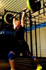 Senior Airman Matthew Lawrence, 319th Civil Engineer Squadron, performs an Olympic lift during a workout at the Cloudy Town Throw Crossfit competition in St. Cloud, Minn., Sept. 15, 2012. CrossFit is a training system composed of functional movements that are used in daily lives such as lifting and jumping. Lawrence placed 13th out of 54 competitors. (U.S. Air Force photo by Staff Sgt. Amanda N. Grabiec)
