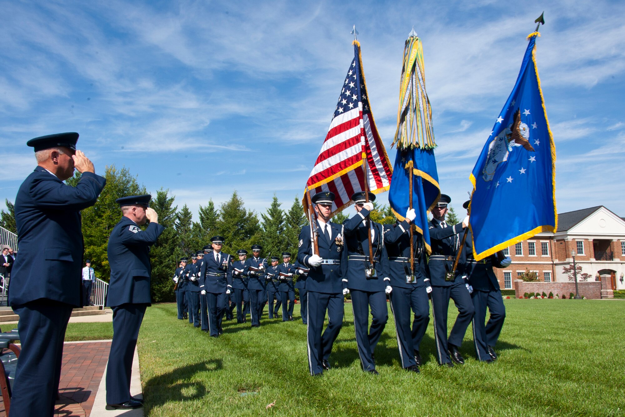 Lt. Gen. Harry M. Wyatt III, the director of the Air National Guard, and Chief Master Sgt. Christopher E. Muncy, the command chief master sergeant to the director of ANG, salute as the U.S. Air Force Honor Guard and U.S. Air Force Band performs a Pass in Review at Joint Base Anacostia-Bolling, D.C., during Muncy’s retirement ceremony on Sept. 20, 2012. Muncy retires after 35 years of military service. (National Guard photo by Master Sgt. Marvin R. Preston/RELEASED)
