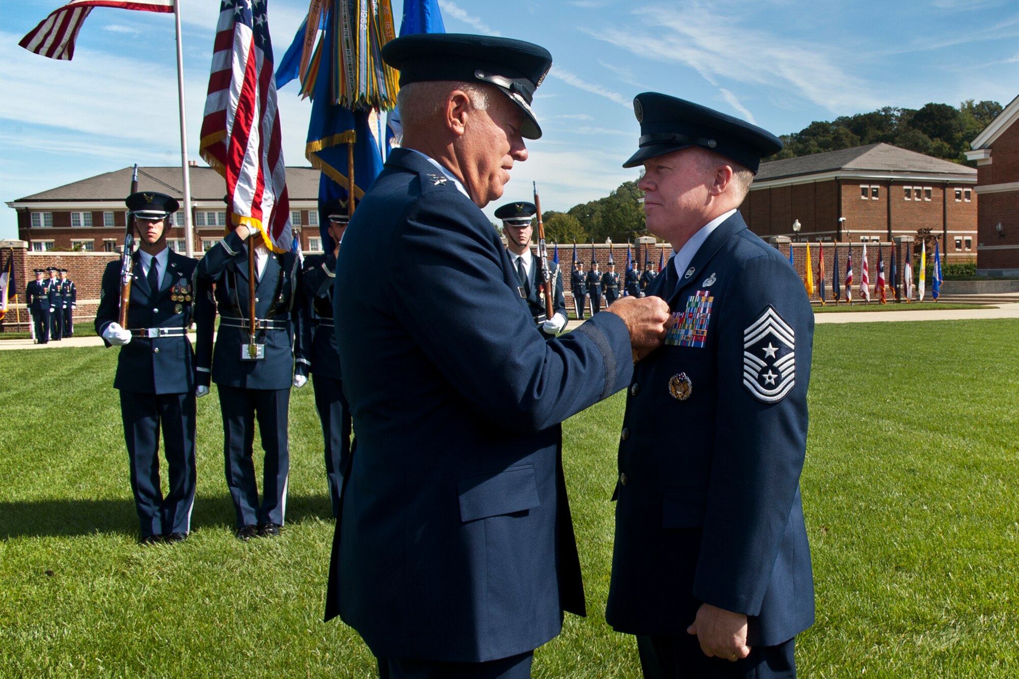 Lt. Gen. Harry M. Wyatt III, the director of the Air National Guard, awards Chief Master Sgt. Christopher E. Muncy, the command chief master sergeant to the director of ANG, the Legion of Merit during his retirement ceremony at Joint Base Anacostia-Bolling, D.C., on Sept. 20, 2012. Muncy retires after 35 years of service. (National Guard photo by Master Sgt. Marvin R. Preston/RELEASED)