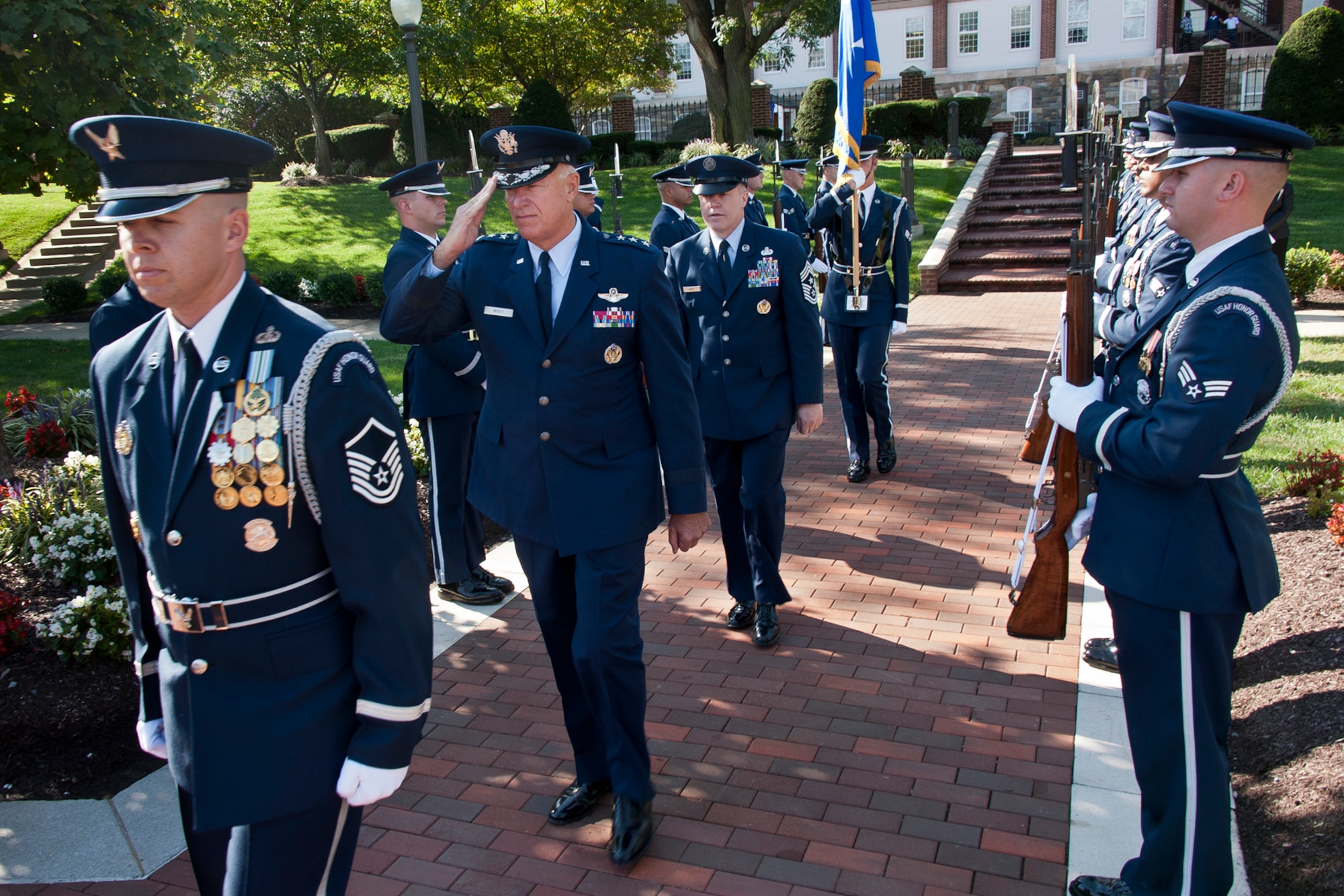 Lt. Gen. Harry M. Wyatt III (second from the left), the director of the Air National Guard, and Chief Master Sgt. Christopher E. Muncy (third from the left), the command chief master sergeant to the director of ANG, arrives at Muncy’s retirement ceremony at Joint Base Anacostia-Bolling, D.C., on Sept. 20, 2012. Muncy retires after 35 years of military service. (National Guard photo by Master Sgt. Marvin R. Preston/RELEASED)
