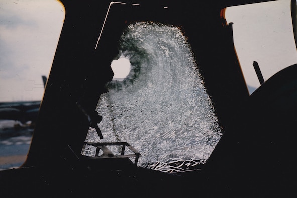 A pilot’s window damaged by a fragment from an SA-2. (U.S. Air Force photo)