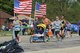 Runners pass a patriotic-themed hydration station during the Air Force Marathon.  Each year the Marathon gives an award to the best hydration station, which have various themes including Star Wars, Aliens and even Elvis.  