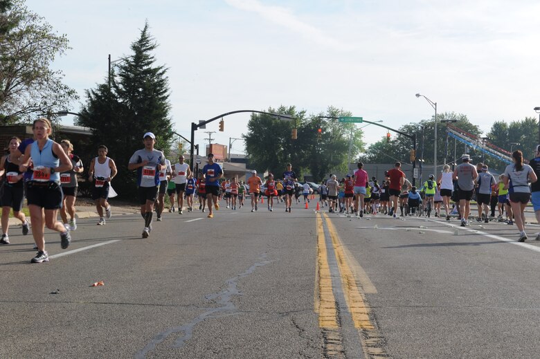 Runners traverse the entrance to Gate 1A on Wright-Patterson AFB during the 2012 Air Force Marathon.  The course departs the base to travel through downtown Fairborn.  


