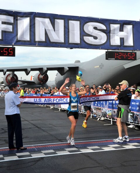 Senior Airman Emily Shertzer, 32, of Jonestown, PA., takes the Women's Half Marathon crown with a time of 1:24:52.  (U.S. Air Force photo/Michelle Gigante)    

