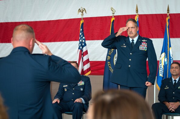 Col. Greg Nelson receives his final salute as commander of the 123rd Airlift Wing during a change-of-command ceremony held in the Fuel Cell Hangar at the Kentucky Air National Guard Base in Louisville, Ky., on Sept. 16, 2012. Nelson has been named deputy director of strategic plans and policy at the National Guard Bureau in Washington, D.C. (U.S. Air Force photo by Senior Airman Maxwell Rechel)