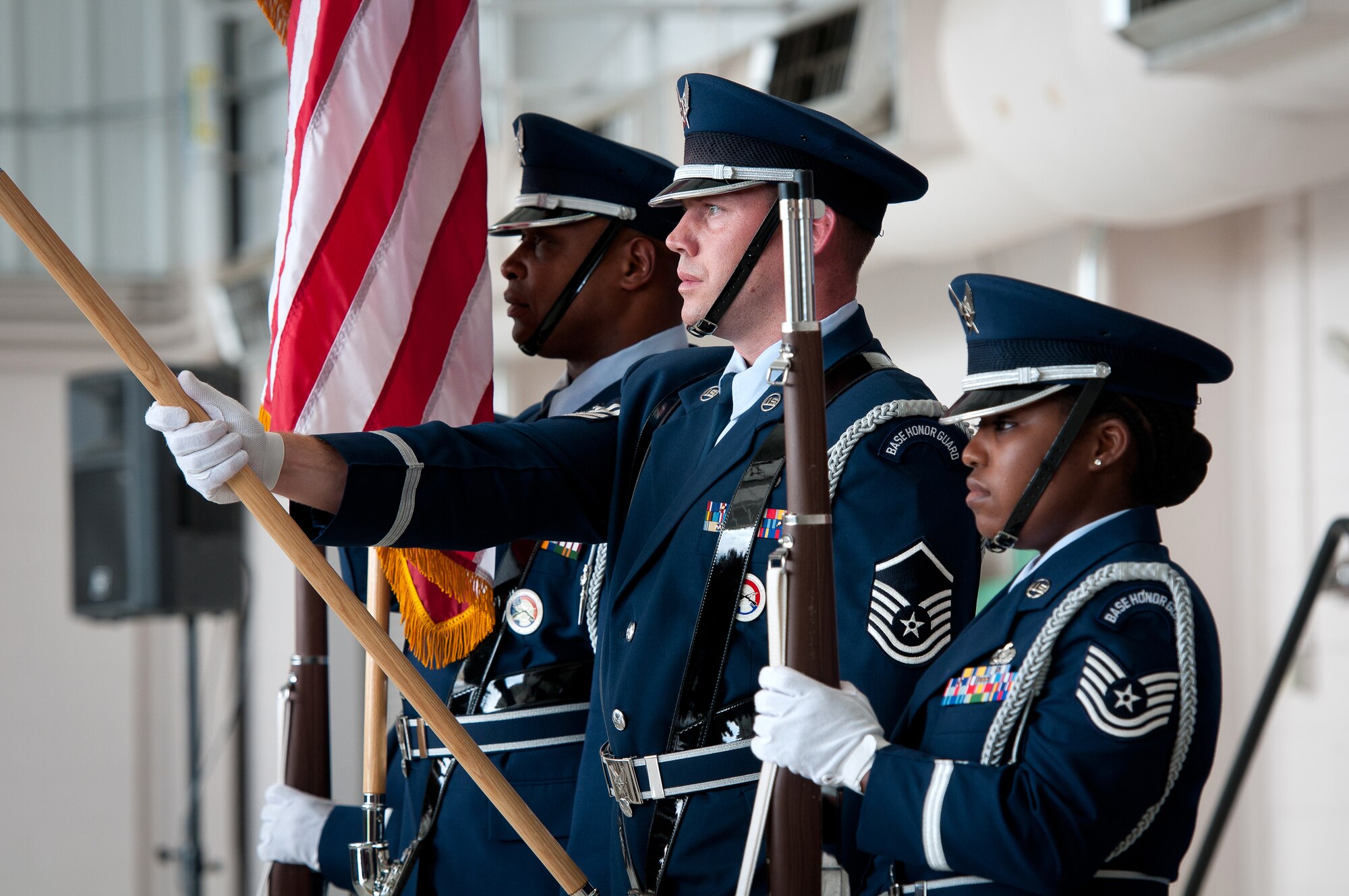 The Base Honor Guard presents the colors during a 123rd Airlift Wing change-of-command ceremony held in the Fuel Cell Hangar at the Kentucky Air National Guard Base in Louisville, Ky., on Sept. 16, 2012. Col. Warren H. Hurst assumed command from Col. Greg Nelson, who has been named deputy director of strategic plans and policy at the National Guard Bureau in Washington, D.C. (U.S. Air Force photo by Senior Airman Maxwell Rechel)