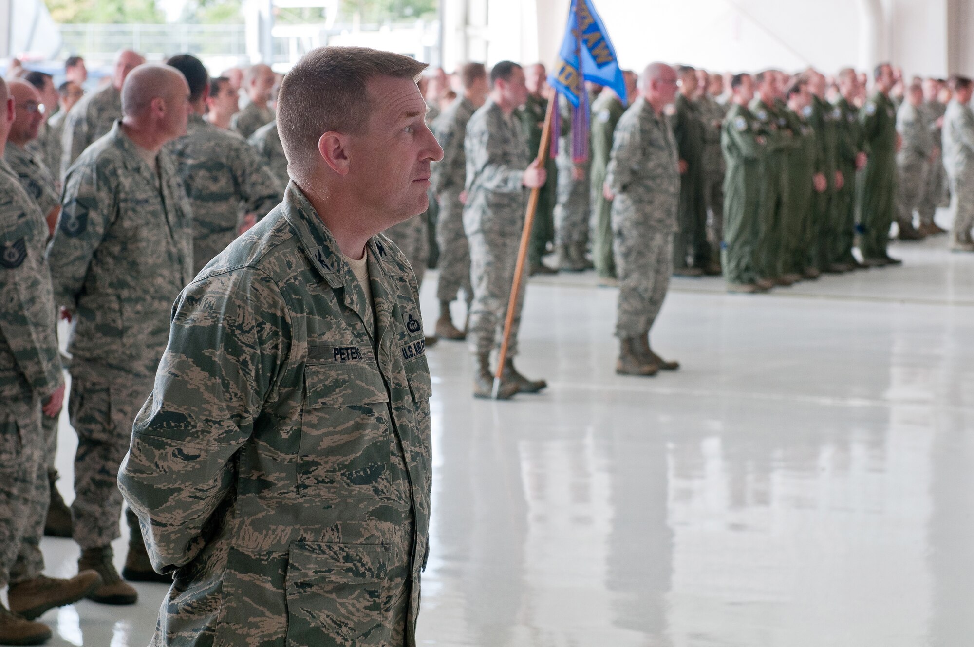 Nearly 1,000 Airmen gather in the Fuel Cell Hangar at the Kentucky Air National Guard Base in Louisville, Ky., for a ceremony Sept. 16, 2012, marking the change of command at the 123rd Airlift Wing. Col. Warren H. Hurst assumed command from Col. Greg Nelson, who has been named deputy director of strategic plans and policy at the National Guard Bureau in Washington, D.C. (U.S. Air Force photo by Senior Airman Maxwell Rechel)