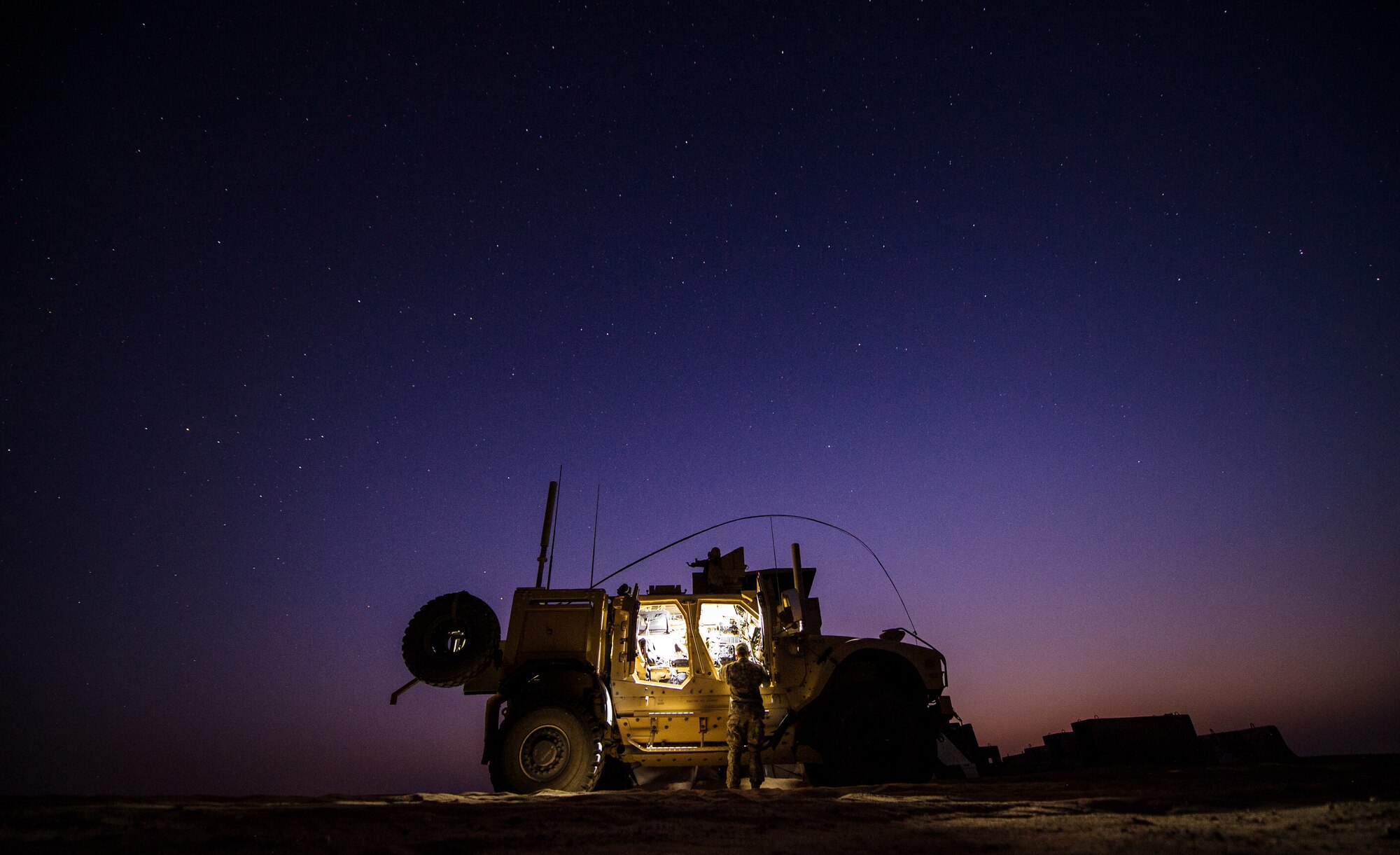 1st Lt. Drew Parks, Air Liaison Officer, 82nd Expeditionary Air Support Operations Squadron, grabs equipment from a Mine-Resistant, Ambush-Protected, All-Terrain Vehicle on Sept. 11, 2012, Southwest Asia. JTAC's establish and maintain command and control communications, control air traffic, naval gun fire, and provide precision terminal attack guidance of U.S. and coalition close air support. Parks hometown is Hampstead, N.C. (U.S. Air Force photo/ Staff Sgt. Jonathan Snyder)  