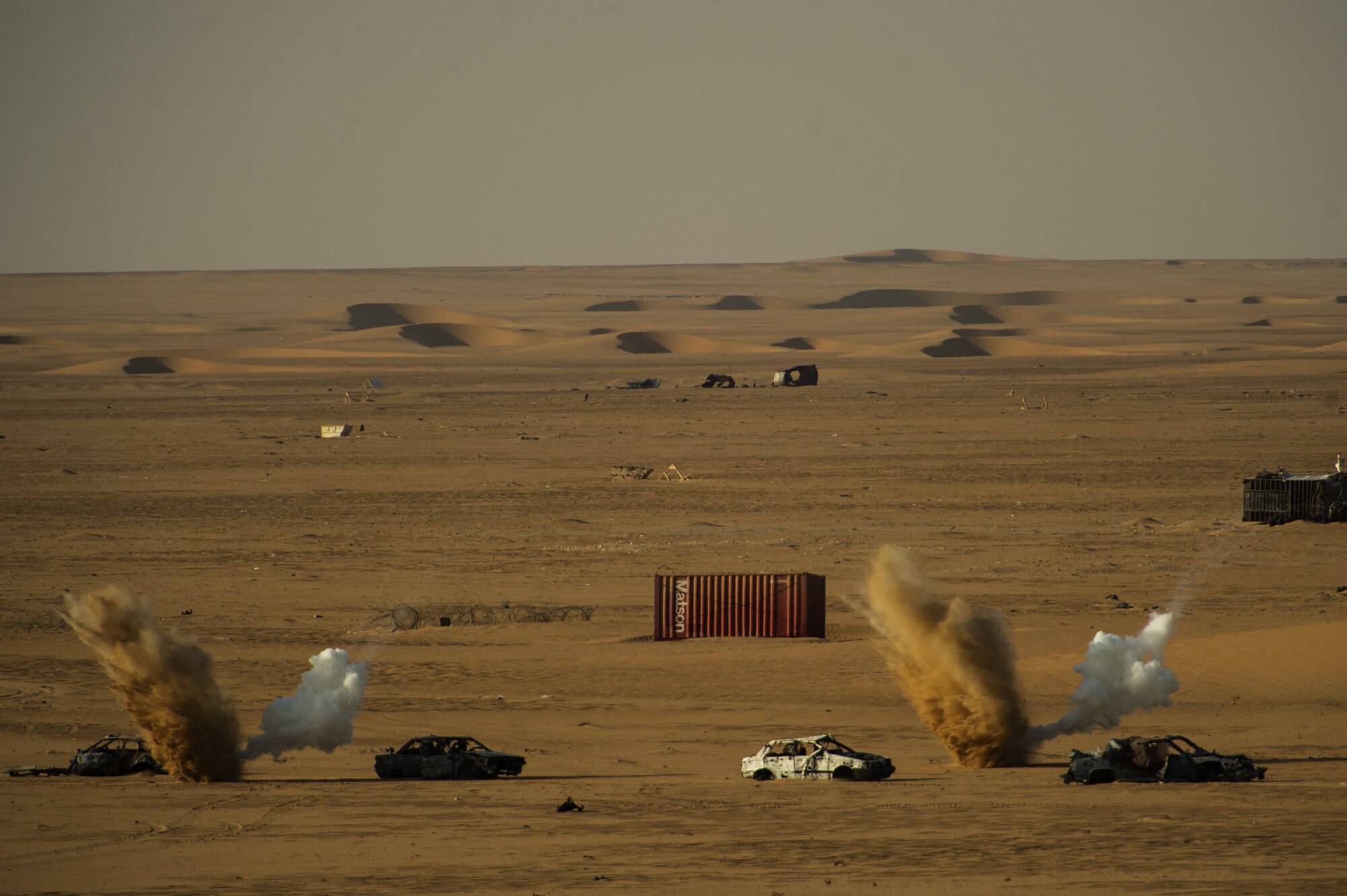 A U.S. Navy F/A-18 Super Hornet hits its designated target with an inert laser guided bomb marked by U.S. Air Force Joint Terminal Attack Controller  supporting Operation Spartan Shield on Sept. 11, 2012, Southwest Asia. JTAC's establish and maintain command and control communications, control air traffic, naval gun fire, and provide precision terminal attack guidance of U.S. and coalition close air support. (U.S. Air Force photo/ Staff Sgt. Jonathan Snyder)  