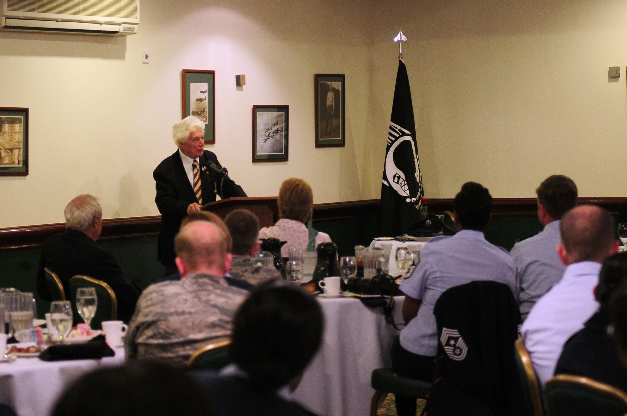 ROYAL AIR FORCE LAKENHEATH, England - Harry Buckledee, a former British Army prisoner of war, speaks to members of the 48th Fighter Wing during a POW/MIA Remembrance luncheon, Sept. 17, 2012. The theme of this year’s POW/MIA Remembrance week is “Never Forgotten,” referring to the hardships and sacrifices former POWs made and serving as a reminder of those who are still missing. (U.S. Air Force photo by Airman 1st Class Cory D. Payne)