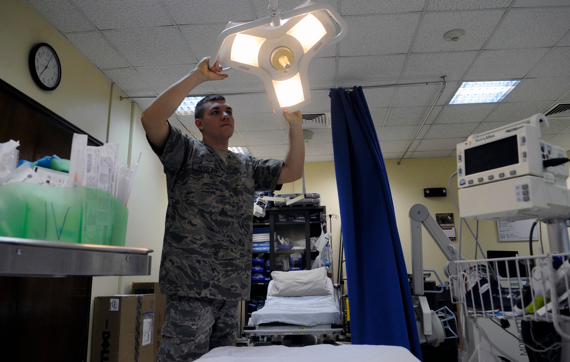 SOUTHWEST ASIA – Airman 1st Class Bryan Retzlaff, 386th Expeditionary Medical Group, aerospace medical technician, prepares for a patient in the triage bay at the medical clinic here Sept. 20. Retzlaff takes care of those on base who get sick and injured as well as transporting injured warriors during air medical evacuation to an alternate location for better observation and medical support that are not capable of doing here. Retzlaff is the 386th Air Expeditionary Wing Rock Solid Warrior.  (U.S. Air Force photo/Staff Sgt Alexandra M. Boutte)