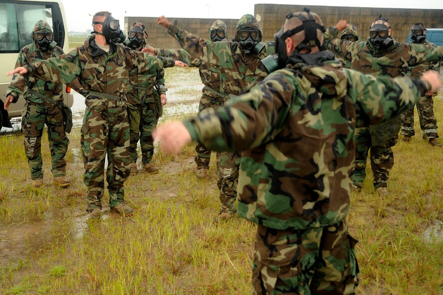 U.S. Army Sgt. Ronnie Hoffman, 74th Delta Company chemical trainer, leads members of Alpha 2-1 Air Defense Artillery through various calisthenics  at Kunsan Air Base, Republic of Korea, Sept. 13, 2012. The exercises allow Soldiers to experience how difficult it is to breathe with a mask during a chemical attack. (U.S. Air Force photo/Senior Airman Marcus Morris)
