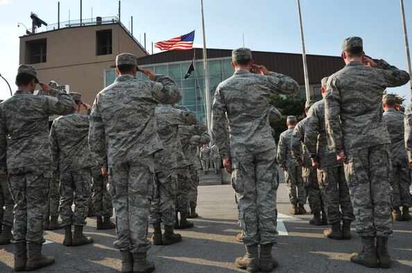Airmen participate in a Prisoner of War/Missing in Action retreat ceremony at Osan Air Base, Republic of Korea, Sept. 20, 2012. Osan held several events throughout the week to include a 24-hour run and candlelight vigil, to remember the more than 83,000 Americans who are missing from World War II, the Korean War, the Cold War, the Vietnam War and the 1991 Gulf War. (U.S. Air Force photo/Staff Sgt. Craig Cisek)