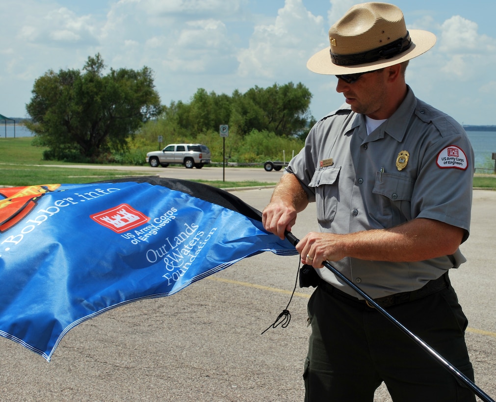 Kenneth Myers, Natural Resource Specialist at the Fort Worth District, U.S. Army Corps of Engineers’ Grapevine Lake puts up banners at key locations of the lake to promote water safety. One hundred banners were donated to the Fort Worth District by the Our Lands & Waters Foundation and will be displayed throughout Dallas-Fort Worth area Corps lakes and at Sam Rayburn Lake as well.