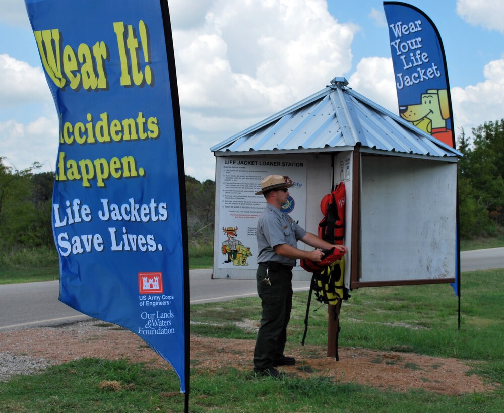 Kenneth Myers, Natural Resource Specialist at the Fort Worth District, U.S. Army Corps of Engineers’ Grapevine Lake puts up banners at key locations of the lake to promote water safety. One hundred banners were donated to the Fort Worth District by the Our Lands & Waters Foundation and will be displayed throughout Dallas-Fort Worth area Corps lakes and at Sam Rayburn Lake as well.